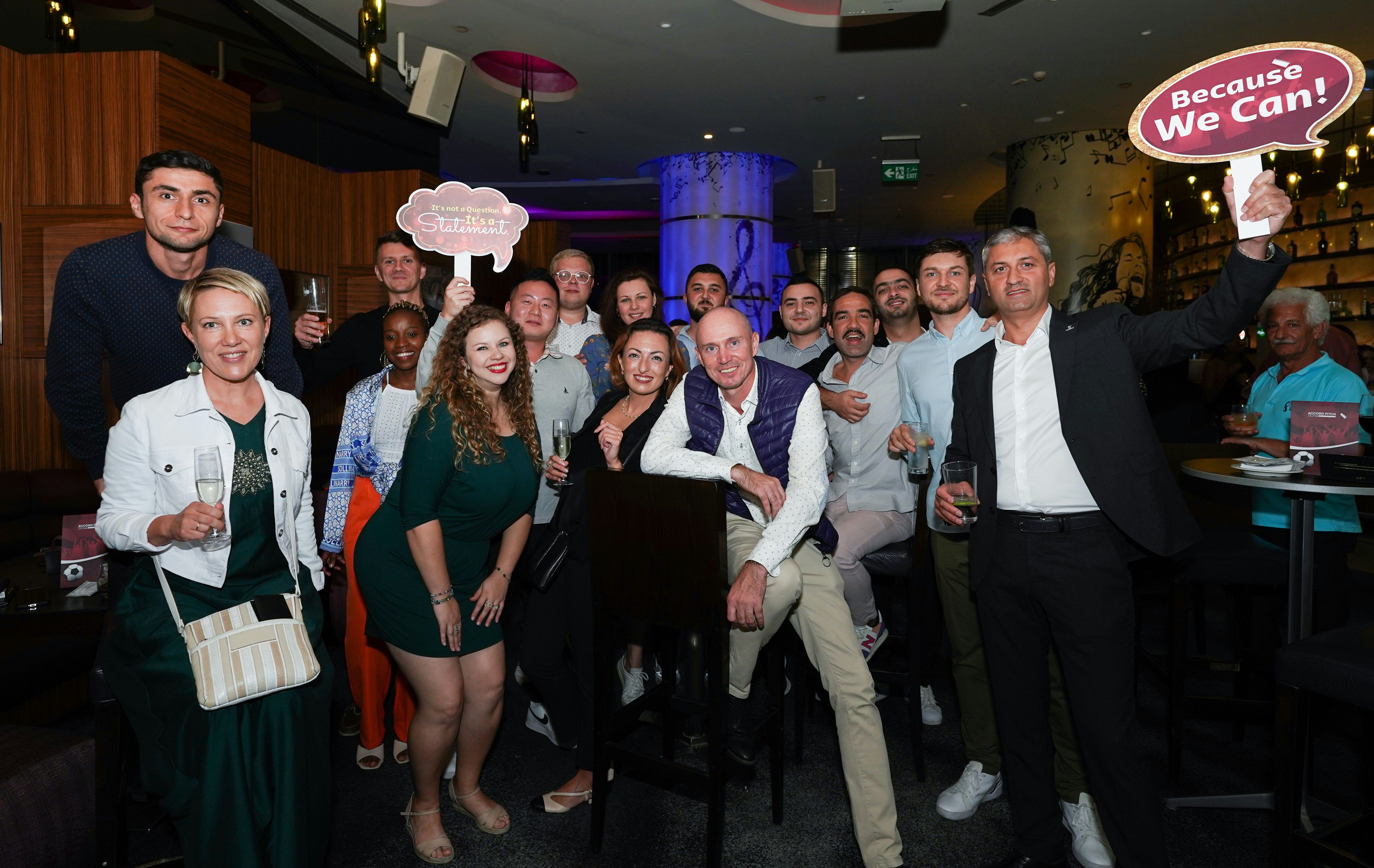 Elegant corporate event space with modern decor, featuring a stage setup perfect for karaoke performances and networking